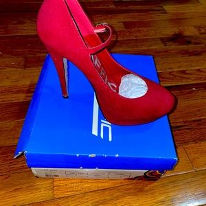Traffic red high heels with strap. size 7.